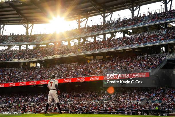 Dansby Swanson of the Atlanta Braves looks on from third base during the first inning against the Milwaukee Brewers in game four of the National...