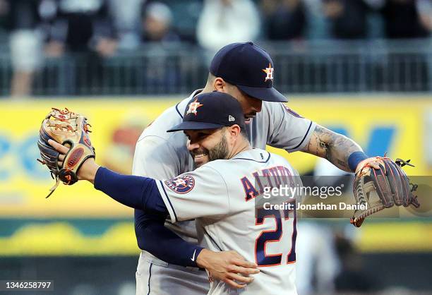 Jose Altuve and Carlos Correa the Houston Astros celebrate as the Astros defeat the Chicago White Sox 10-1 to win Game 4 of the American League...
