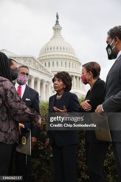 House Financial Services Chair Maxine Waters talks with committee members Rep. Nikema Williams , Rep. Al Green , Rep. Emanuel Cleaver , Rep. Nydia...