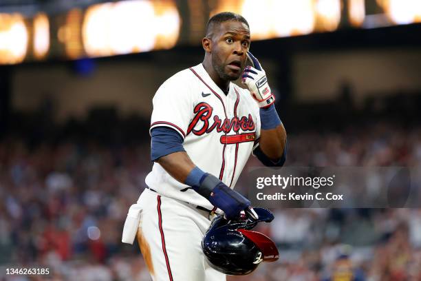 Guillermo Heredia of the Atlanta Braves yells towards the Milwaukee Brewers bench during the fourth inning in game four of the National League...