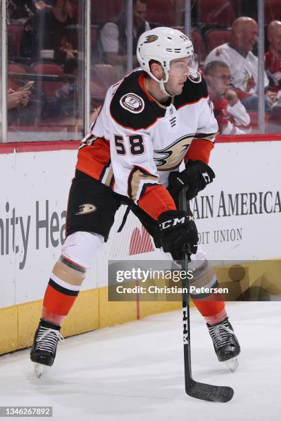 Brogan Rafferty of the Anaheim Ducks skates with the puck during the NHL game at Gila River Arena on October 02, 2021 in Glendale, Arizona. The...