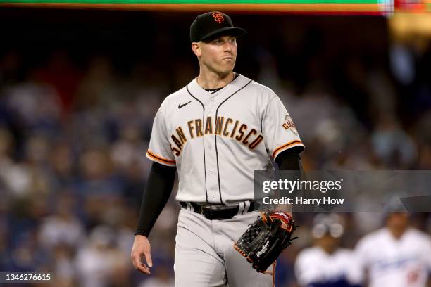 Anthony DeSclafani of the San Francisco Giants leaves the game against the Los Angeles Dodgers during the second inning in game 4 of the National...