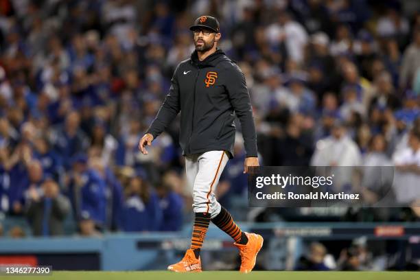 Manager Gabe Kapler of the San Francisco Giants makes a pitching change against the Los Angeles Dodgers during the second inning in game 4 of the...