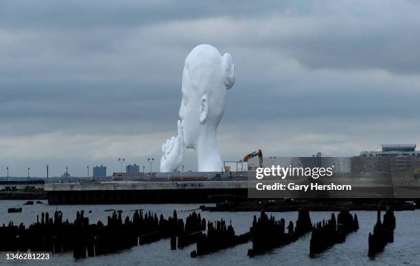 Sculpture named "Water's Soul" by Spanish artist Jaume Plensa sits in a park under construction along the Hudson River across from New York City on...