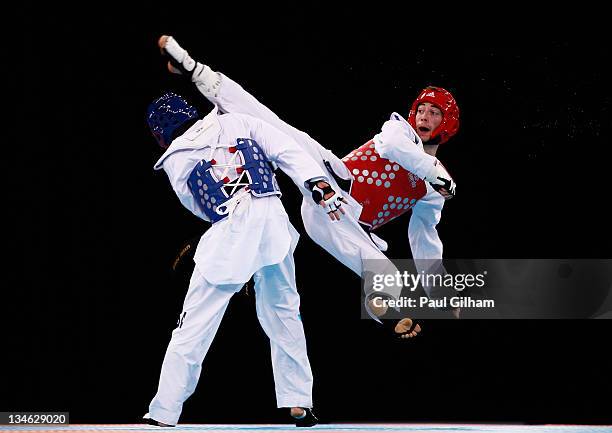 Michael Magee of Australia in action against Levent Tuncat of Germany during the Taekwondo preliminary round at the London Prepares LOCOG Test Event...