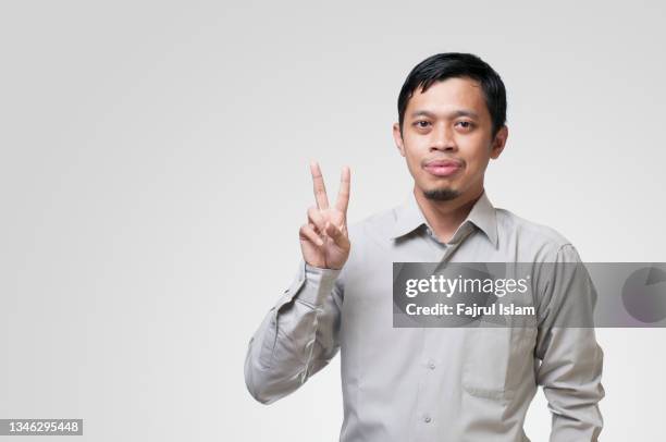 asian men showing number with his finger - second stock pictures, royalty-free photos & images