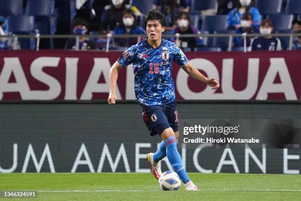 Takehiro Tomiyasu of Japan in action during the FIFA World Cup Asian qualifier Group B match between Japan and Australia at Saitama Stadium on...