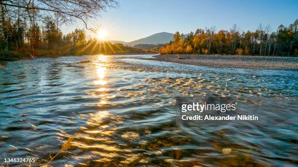 sunset on the taiga river in the sayan mountains in september - river east stock pictures, royalty-free photos & images