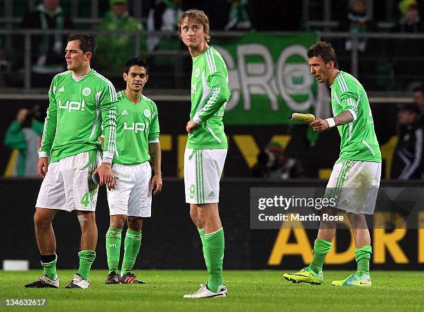 Mario Mandzukic of Wolfsburg argues with his team mates Marcel Schaefer, joseu and Bjarne Thoelke during the Bundesliga match between VfL Wolfsburg...