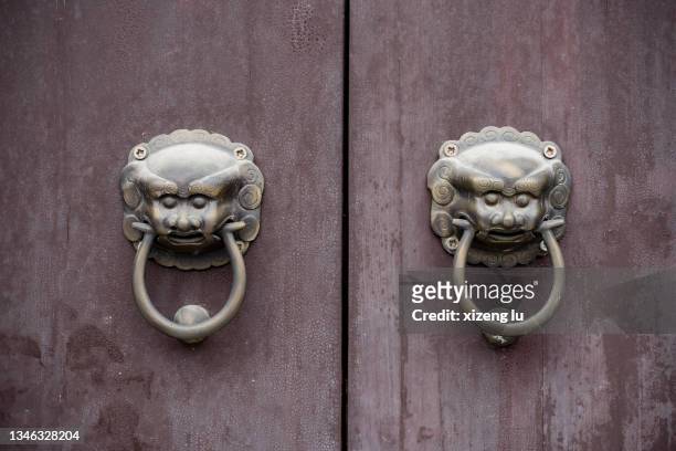 lion heads door knockers - door knocker stock pictures, royalty-free photos & images