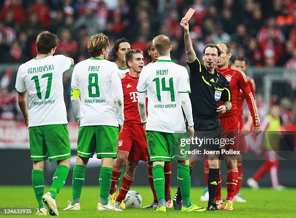 Aaron Hunt of Bremen gets the red card from referee Florian Meyer during the Bundesliga match between FC Bayern Muenchen and SV Werder Bremen at...