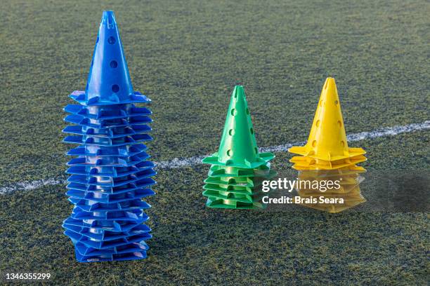 soccer field with stacked cones - kegel exercise stockfoto's en -beelden