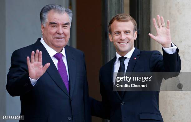 French President Emmanuel Macron welcomes Tajikistan President Emomali Rahmon prior to a working lunch at the Elysee Palace on October 13, 2021 in...