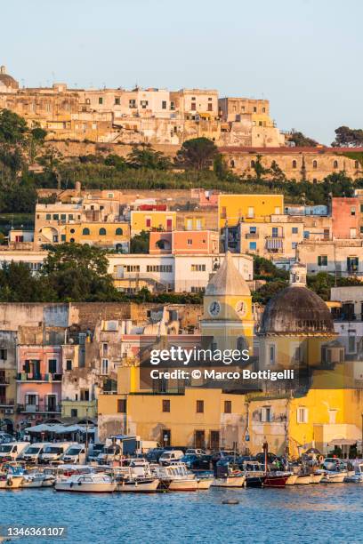 the old harbor of procida island, italy - naples italy church stock pictures, royalty-free photos & images