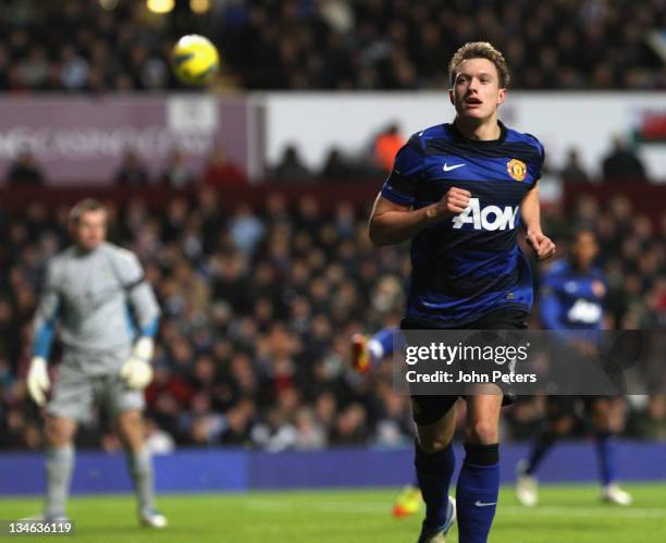 Phil Jones of Manchester United celebrates scoring their first goal during the Barclays Premier League match between Aston Villa and Manchester...