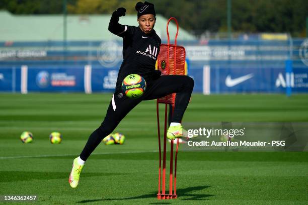 Kylian Mbappe controls the ball during a Paris Saint-Germain training session at Ooredoo Center on October 13, 2021 in Paris, France.