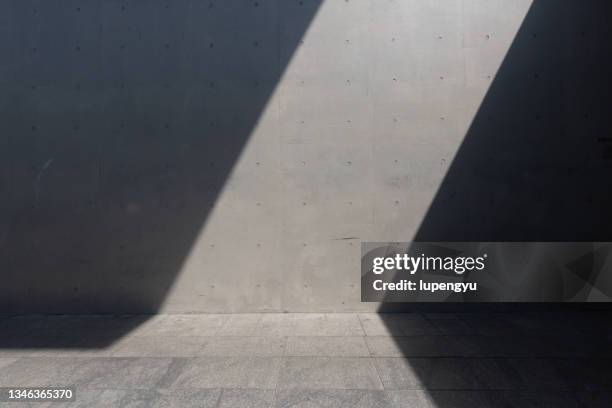 concrete wall with shadow - shadow stock pictures, royalty-free photos & images