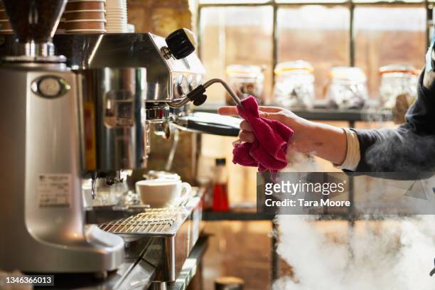 cleaning coffee machine in cafe. - espresso maker fotografías e imágenes de stock