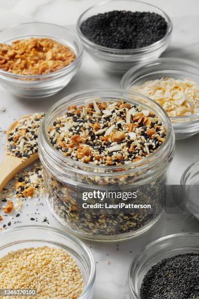 making everything bagel seasoning - poppy seed stock pictures, royalty-free photos & images