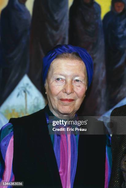 French writer Simone de Beauvoir at the opening of her sister's, Helène de Beauvoir, exhibition of paintings.