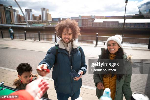 paying for our ice creams - food truck payments stock pictures, royalty-free photos & images