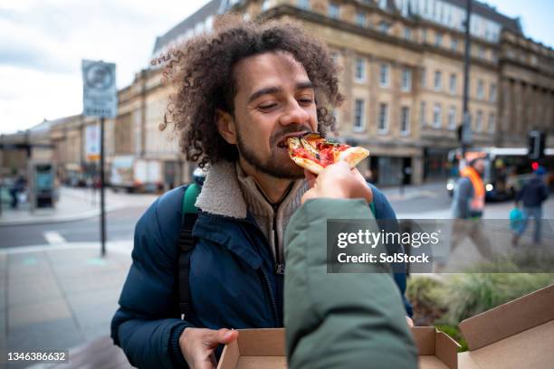 feeding my boyfriend pizza - point of view stock pictures, royalty-free photos & images