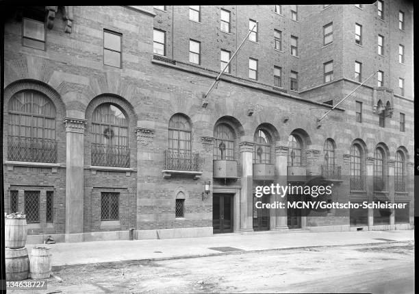 Series of three wooden barrels sitting in street. The Barbizon was a residence-hotel for women that was located on 63rd Street and Lexington Avenue....