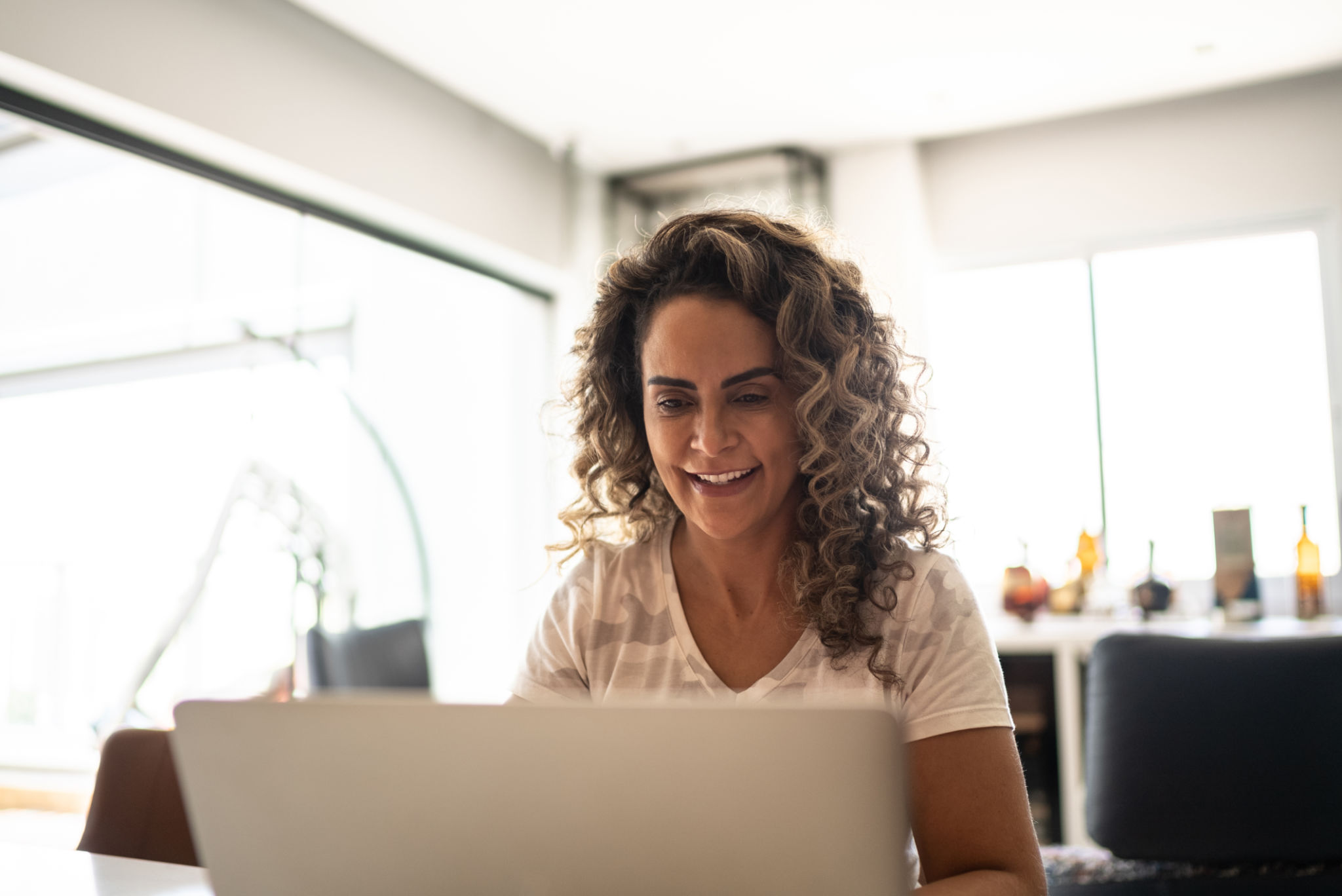 Mature woman using laptop at home Mature woman using laptop at home