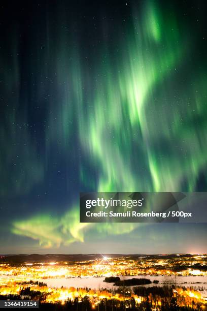 scenic view of illuminated landscape against sky at night,rovaniemi,finland - rovaniemi stock pictures, royalty-free photos & images