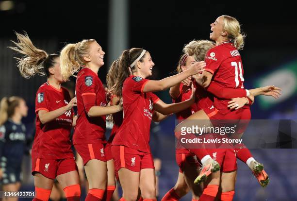 Ashley Hodson of Liverpool is congratulated after scoring her sides winning goal in the penalty shootout during the FA Women's Continental Tyres...