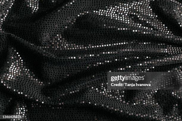 black textile fabric with shiny sequins as background. - fashion show background stock pictures, royalty-free photos & images