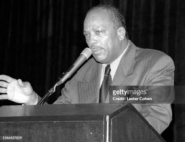 American record producer, musician, songwriter, composer, arranger, and film and television producer Quincy Jones speaks at the podium during the...