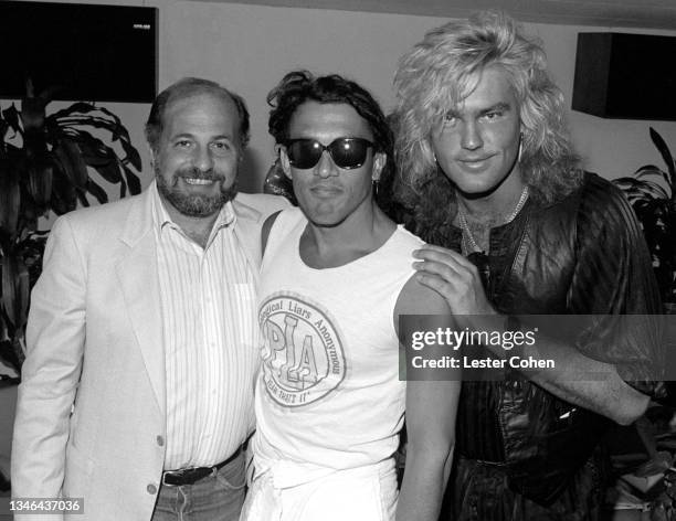 American record executive Doug Morris poses for a portrait with American musician Stephen Pearcy and American guitarist Robbin Crosby , of the...