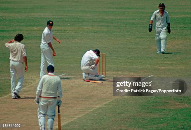 John Edrich after being hit by a ball from Dennis Lillee ; it cracked a rib. Also in the photograph Rick McCosker, Colin Cowdrey and Rodney Marsh,...