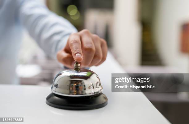 close-up on a receptionist and ringing the bell at a hotel - serviço de quarto imagens e fotografias de stock