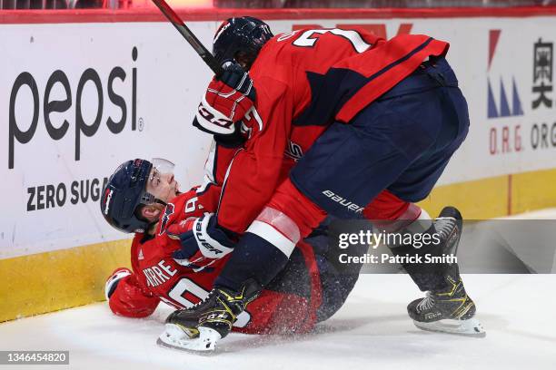 Hendrix Lapierre of the Washington Capitals celebrates his first career NHL goal with teammate T.J. Oshie against the New York Rangers during the...