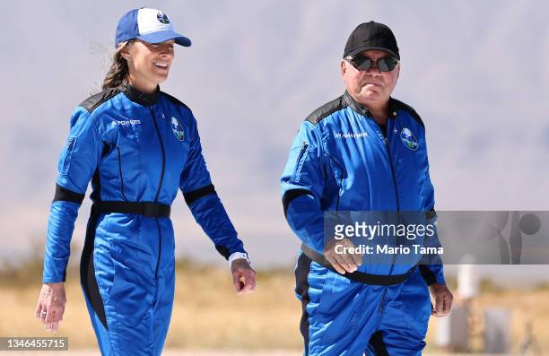 Blue Origin vice president of mission and flight operations Audrey Powers walks with Star Trek actor William Shatner to a media availability on the...