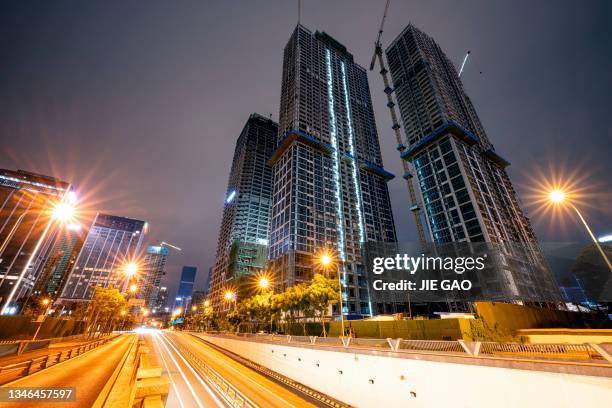 lighting night shooting at chengdu ' s park, bustling city streets and modern buildings - bridge building glass stock pictures, royalty-free photos & images