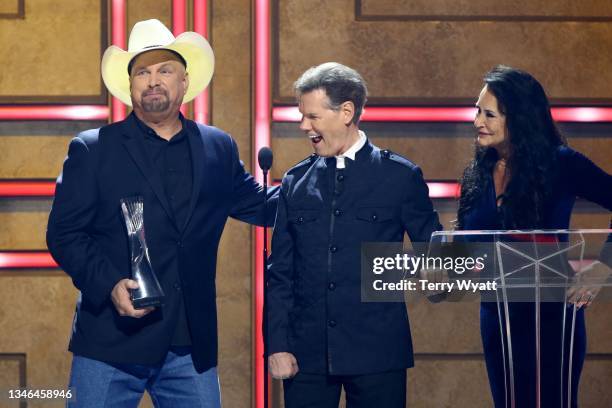 Garth Brooks awards Randy Travis their Artists of a Lifetime award onstage with Mary Travis during 2021 CMT Artist Of The Year at Schermerhorn...