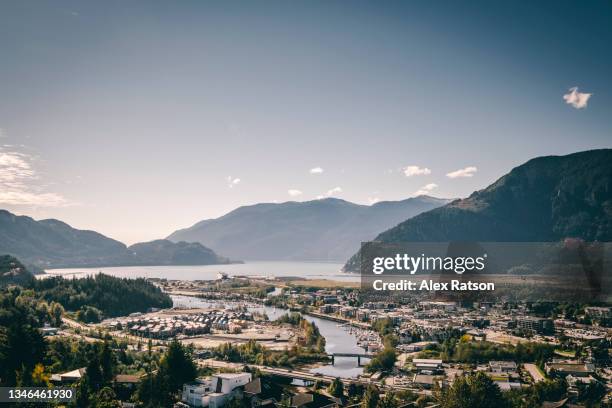 aerial view of squamish, british columbia on sunny day - british columbia stock pictures, royalty-free photos & images