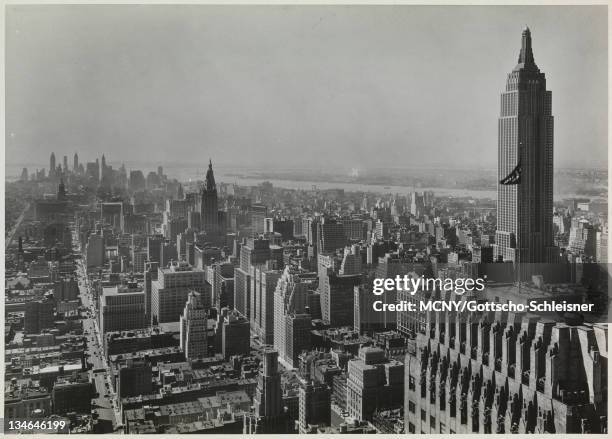 View facing south from the Chrysler Building. Midtown Manhattan is visible in the foreground and the skyscrapers of the Lower Manhattan and the...