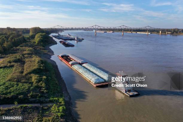 Tug pushes barges on the Ohio River on October 12, 2021 near Cairo, Illinois. According to U.S. Census data, Alexander County Illinois, of which...