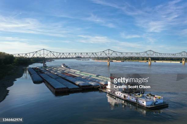 Tug pushes barges on the Ohio River on October 12, 2021 near Cairo, Illinois. According to U.S. Census data, Alexander County Illinois, of which...