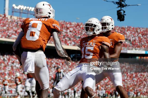 Marcus Washington of the Texas Longhorns celebrates with Xavier Worthy of the Texas Longhorns after a fourth quarter touchdown reception against the...