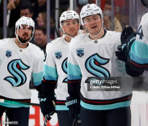 Ryan Donato of the Seattle Kraken celebrates with teammates on the bench after scoring a goal at 11:32 of the second period against the Vegas Golden...