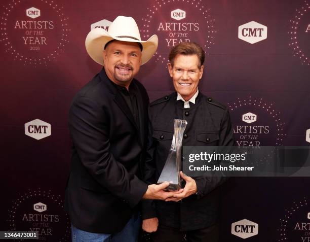Garth Brooks and Randy Travis attend the 2021 CMT Artist of the Year on October 13, 2021 in Nashville, Tennessee.