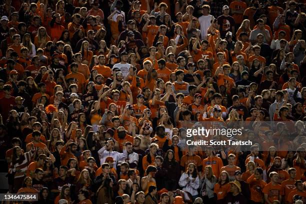 Fans cheer during the second half of the game between the Virginia Tech Hokies and the Notre Dame Fighting Irish at Lane Stadium on October 9, 2021...