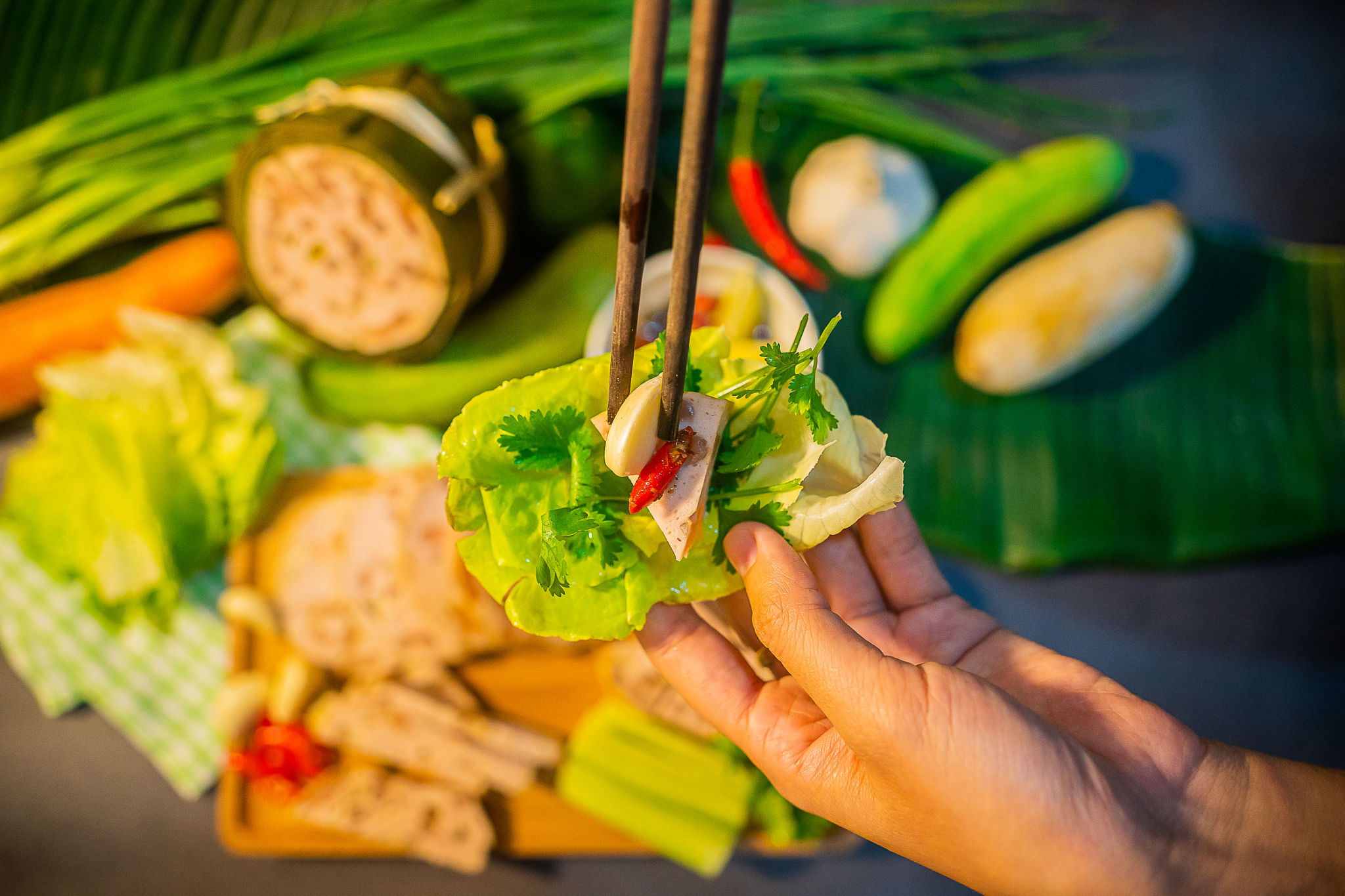 Traditional Vietnamese food, pork sausage or pork bologna with pepper, lemon and salt sauce on colorful background Traditional Vietnamese food, pork sausage or pork bologna with pepper, lemon and salt sauce on colorful background