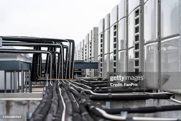 air-conditioning external unit pipeline on the roof - air cooler stock pictures, royalty-free photos & images