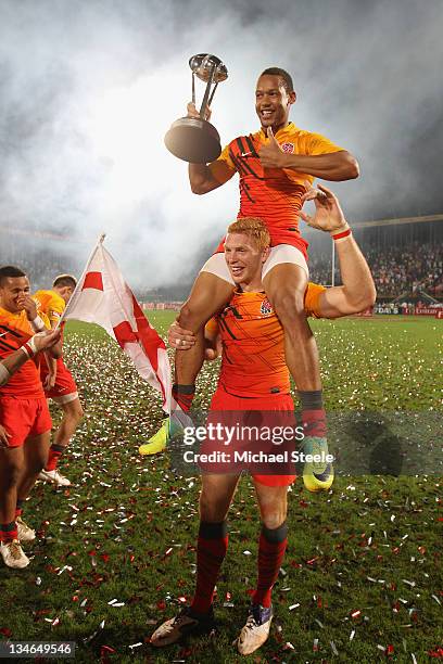 James Rodwell of England holds Dan Norton aloft as they celebrate their 29-12 victory during the Final match between England and France on Day Three...